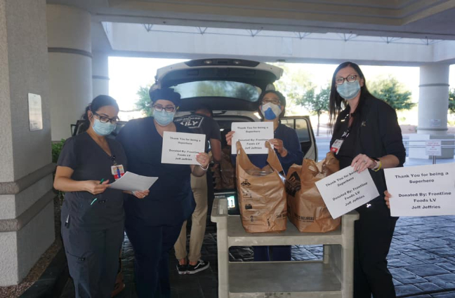 Scott White serves BBQ to Henderson hospital